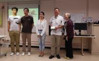 Prof Richard So (2nd from right) and his PhD students (from left) Shutao Chen, Jun Hui and Tingyi Wang received a souvenir from Ms Vivian Wong, Chairlady of the Hong Kong Parents Association for the Hearing Impaired.