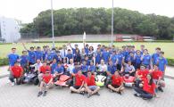 The students from five secondary schools, together with the cars they had built, pose for a picture with the judges and the HKUST student helpers.	 