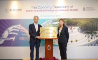 Prof Wei Shyy, President of HKUST (left), and Prof Pascale Fung, Founding Director of the Center for Artificial Intelligence Research, unveil the plaque for CAiRE.	 