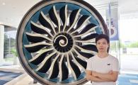 James with an airplane engine at GE Aviation, Shanghai.