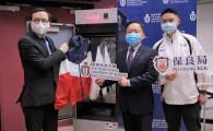 Prof. Ricky LEE Shi-Wei (middle), Chair Professor of the Department of Mechanical and Aerospace Engineering at HKUST, demonstrates how the UVC LED disinfection closet works, along with Mr. LAM Kwok-Wai (left) and Mr. Martin MAK, Principal and Assistant Warden respectively of the Po Leung Kuk Yu Lee Mo Fan Memorial School. 