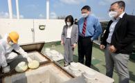 Photo from the Information Services Department showing The Commissioner for Innovation and Technology, Ms Rebecca Pun (second left); Professor of the Department of Chemical and Biological Engineering and Division of Environment and Sustainability of the Hong Kong University of Science and Technology, Professor Yeung King-lun (second right); and Assistant Director of Housing Mr Michael Hong (first right), visited the Yue Wan Estate at Chai Wan under the Housing Authority today (April 27) to inspect the trial