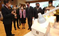 HKUST researchers introduce their research projects to Prof. SUN Dong, Secretary for Innovation, Technology and Industry of the Hong Kong Special Administrative Region (HKSAR) (third right), Prof. Nancy IP, HKUST President (third left), Prof. Tim CHENG, HKUST Vice-President for Research and Development (second left)