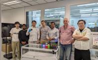 Dr. Kang Chengbin (3rd left) is holding a white LED and Prof. Abhishek Srivastava (3rd right) with a set of QRLED prototypes in his hand and various monochromatic quantum rods on the table. Other co-authors are Liao Zebing (1st left), Kumar Mallem (2nd left), Dr. Maksym Prodanov (center), Dr. Valerii Vashchenko (2nd right) and Song Jianxin (1st right).