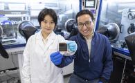 Prof. Zhou Yuanyuan (right) and Dr. Duan Tianwei (left) holding their newly developed perovskite solar cell.