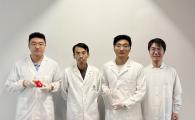 Prof. Yang Zhengbao (second left), Associate Professor at HKUST’s Department of Mechanical and Aerospace Engineering, with the three co-first authors of the study: HKUST postdoctoral fellow Dr. Li Xuemu (second right, holding a roll of printed glycine films), CityU PhD graduate Dr. Zhang Zhuomin (first right), and CityU PhD Student Zheng Yi (first left, with a glycine patch in his hands).