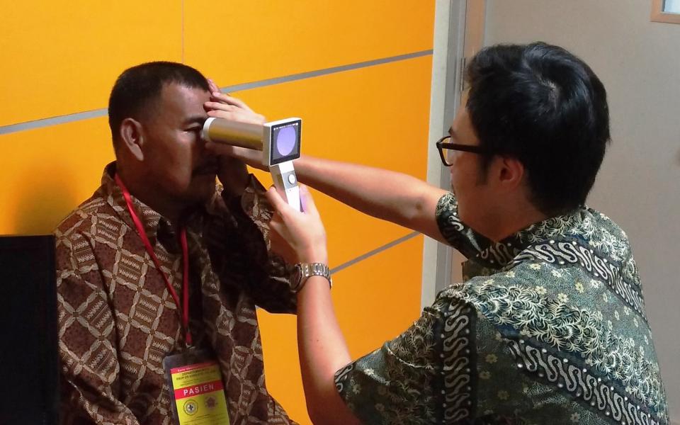 The student is testing the use of a portable fundus camera for diabetic retinopathy screening in a clinic in Indonesia.