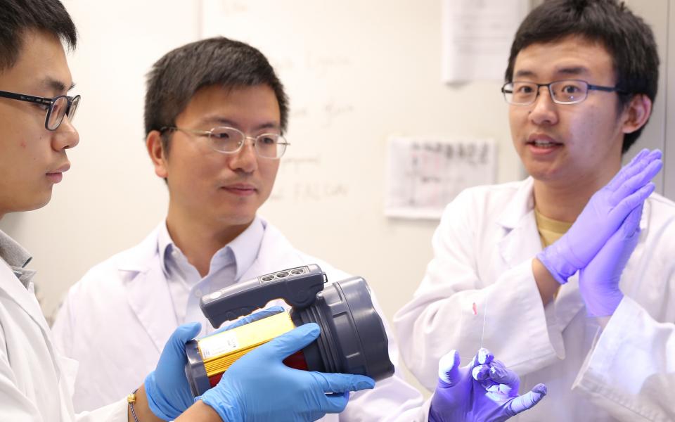 Prof Fei Sun (middle) and his research team