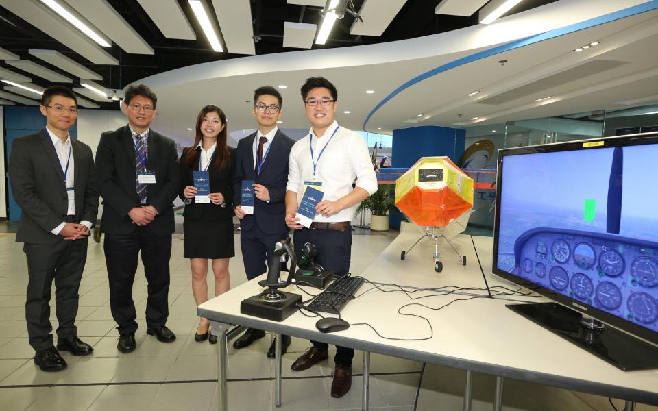 Head and Chair Professor of Mechanical and Aerospace Engineering (MAE) Prof Christopher Chao (2nd from left), Assistant Professor of MAE Prof Larry Li (1st from left) and MAE students who organize HKUST Aero Day, with a modal plane which students built for an international flying competition. 