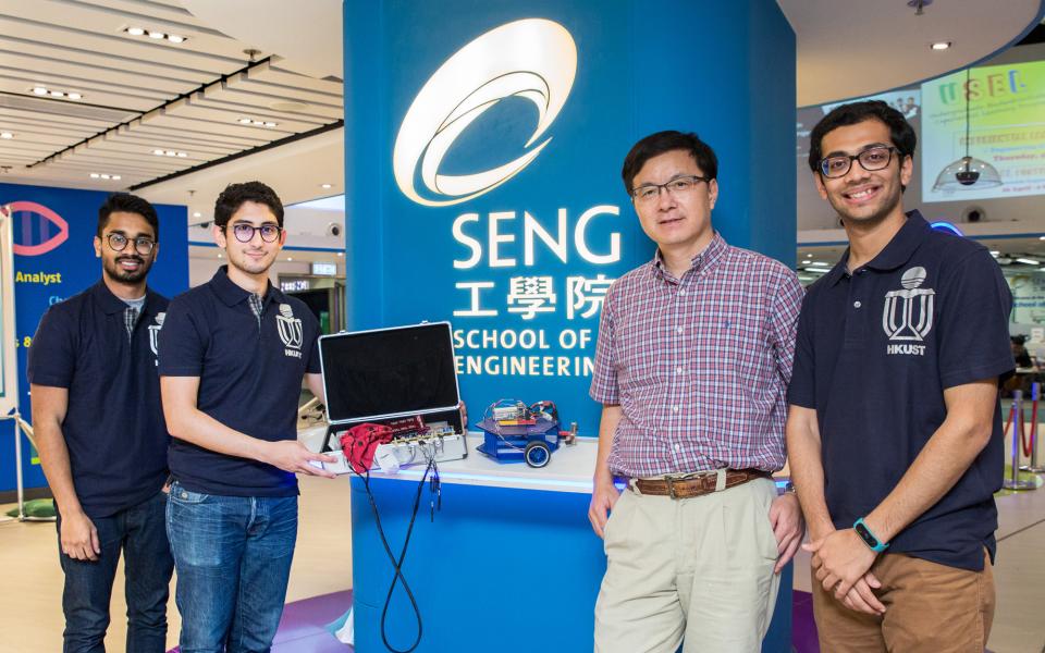 Team of “Brain-Computer Interface for Wheelchair Control” (From left) Saif AHMED, Year 4 Student in Computer Engineering and General Business Management, HKUST Ahmed BEN AYED, Year 4 Student in Electronic and Computer Engineering, HKUST Prof Jianan QU, Professor of Electronic and Computer Engineering, HKUST Jainam MEHTA, Year 4 Student in Electronic and Computer Engineering, HKUST