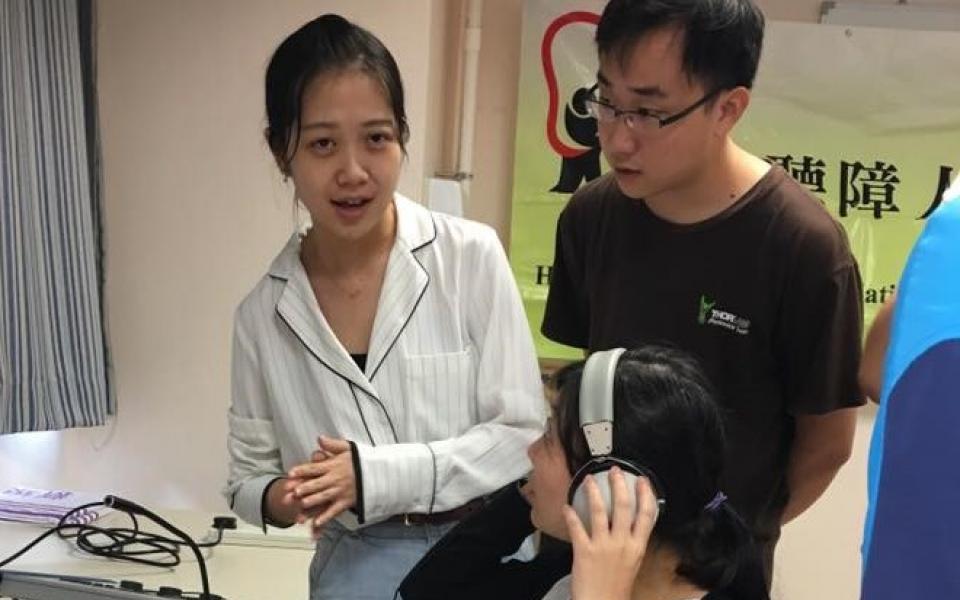 Students Tingyi and Jun demonstrated their simulated audio technology which enabled parents to experience what their hearing-impaired children are listening to every day.