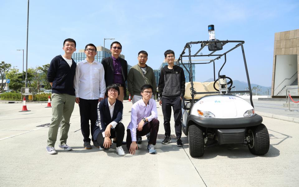 Prof Ming Liu (middle standing) and his team of students who developed the ground-breaking unmanned car.