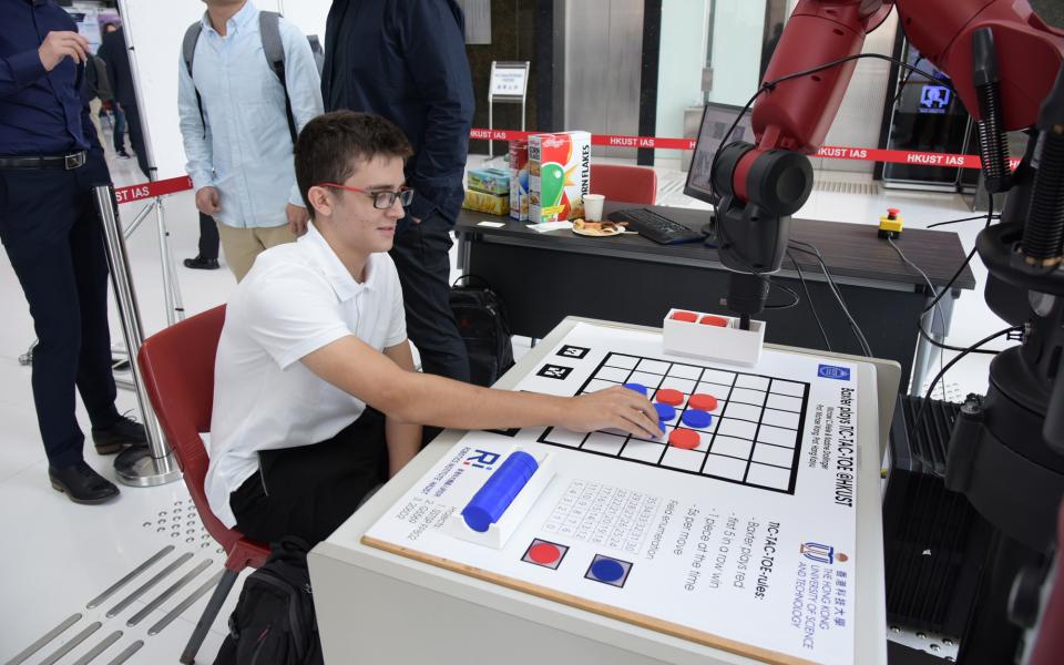 Baxter the robot playing a game of tic-tac-toe chess.