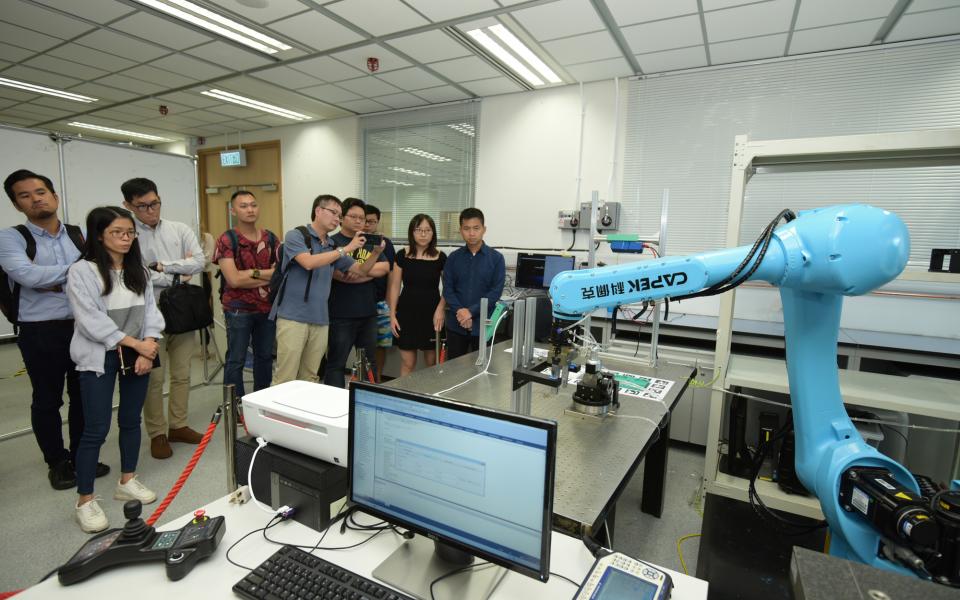 Demonstration of a robotic arm at the HKUST Robotics Institute.