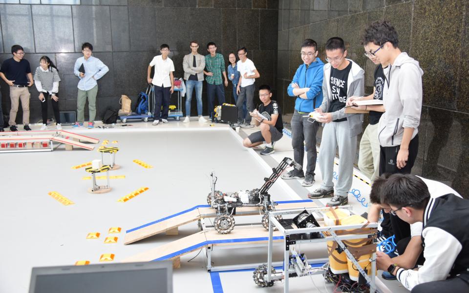 HKUST students and their robot.