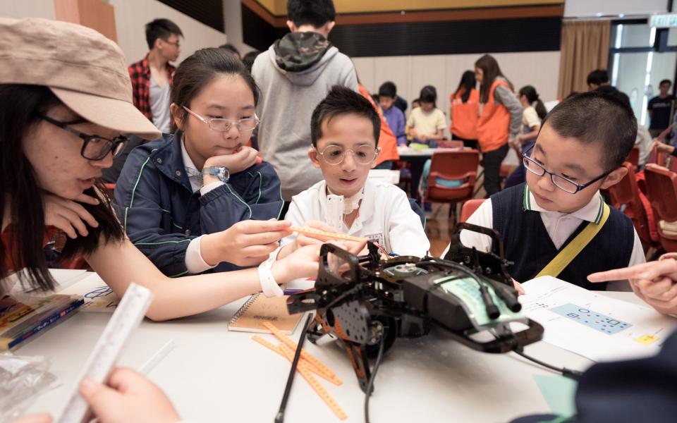 Students are trying to improve the performance of their robot.