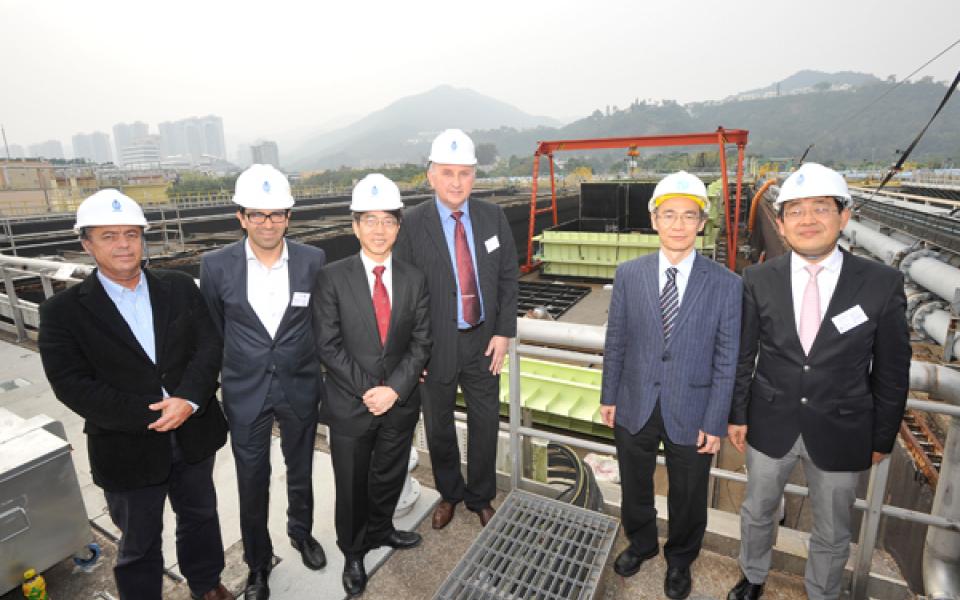 The consortium partners, joined by Mr Wing-cheong Fung (second from right), Senior Electrical & Mechanical Engineer, Electrical & Mechanical Projects Division of the Drainage Services Department, visit the SANI Sewage Treatment Plant at the Shatin Sewage Treatment Works.