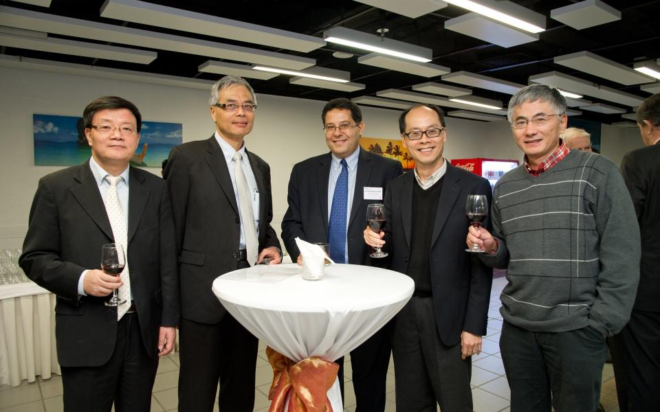 Faculty members and guests enjoying a warm and joyful gathering after the keynote. 