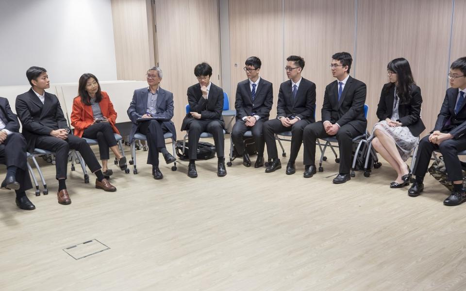 Mr Will Lam(1st Left), listens attentively to the interesting exchange experiences of the students.