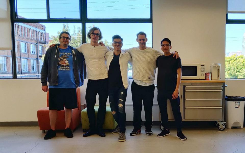 Alan (middle) poses for a photo with his colleagues at the start-up company he worked at during his internship in San Francisco.