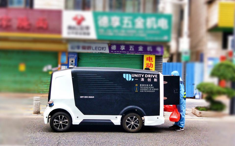 Herculus I, another slow speed unmanned parcel delivery vehicle, is delivering lunch boxes to the staff of a quarantined village in Pingshan District in Shenzhen.