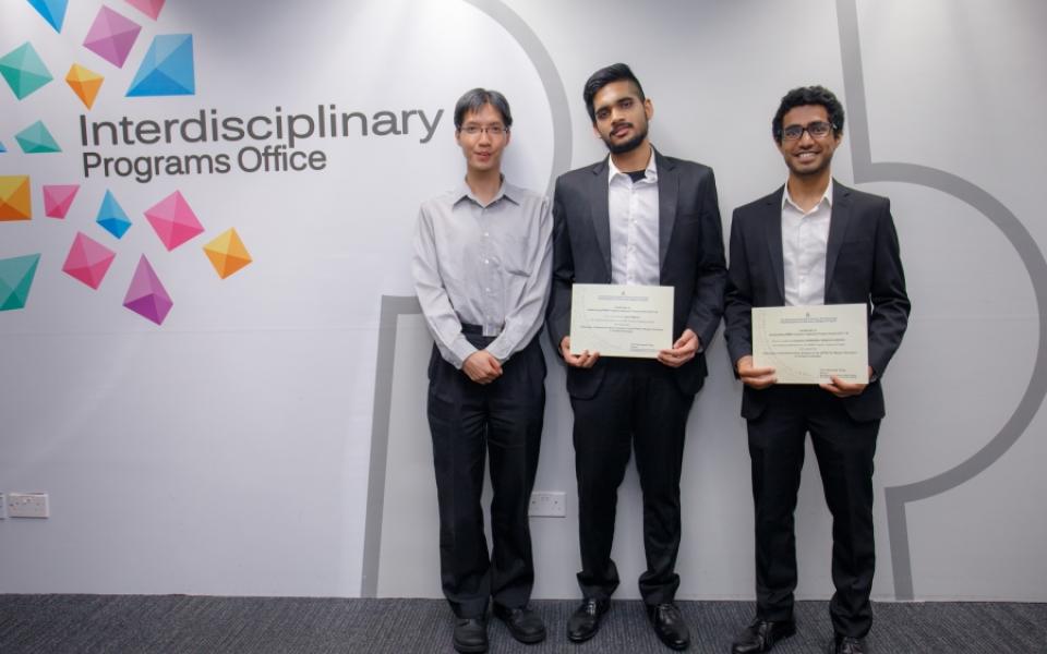 Prof. Raymond Wong (left), RMBI Program Director, presented award certificates to Team A awardees