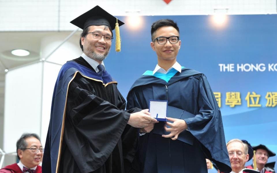 Prof. King L CHOW, Director of IPO (left) presented the Academic Achievement Medal to RMBI graduate, David WEN