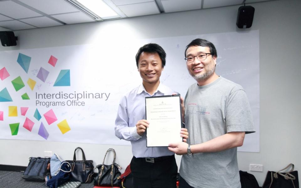 Rax LAU (left) receives the IPO Outstanding Community Service Award from Prof. King L. CHOW, Director of IPO