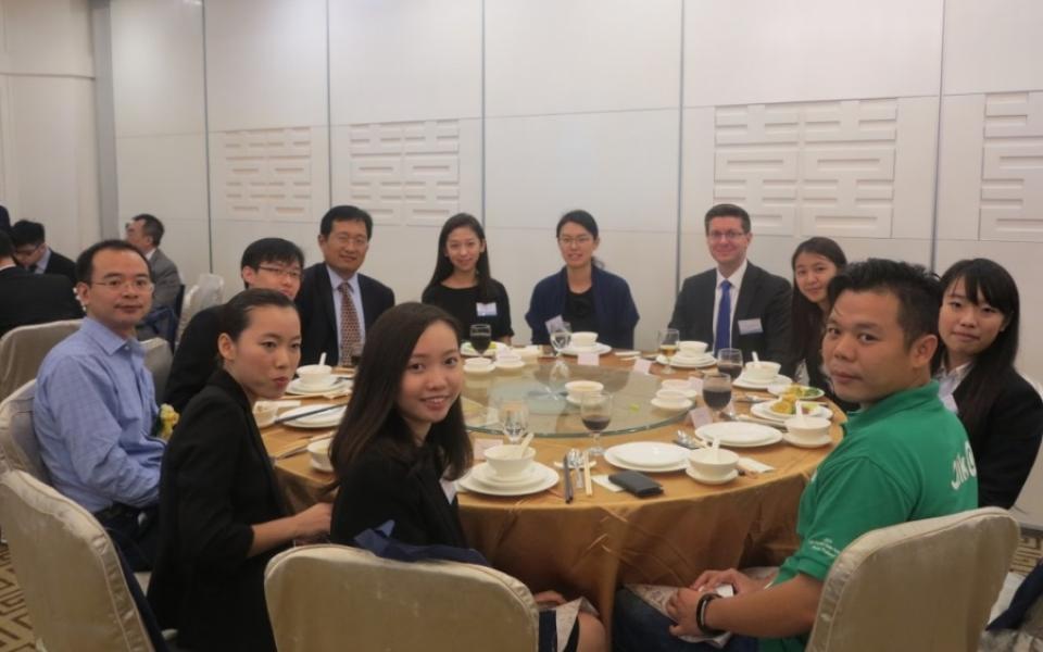 Prof. Xianhua PENG (left, in blue shirt), Program Co-Director of RMBI, attended the dinner to mingle with mentors and students