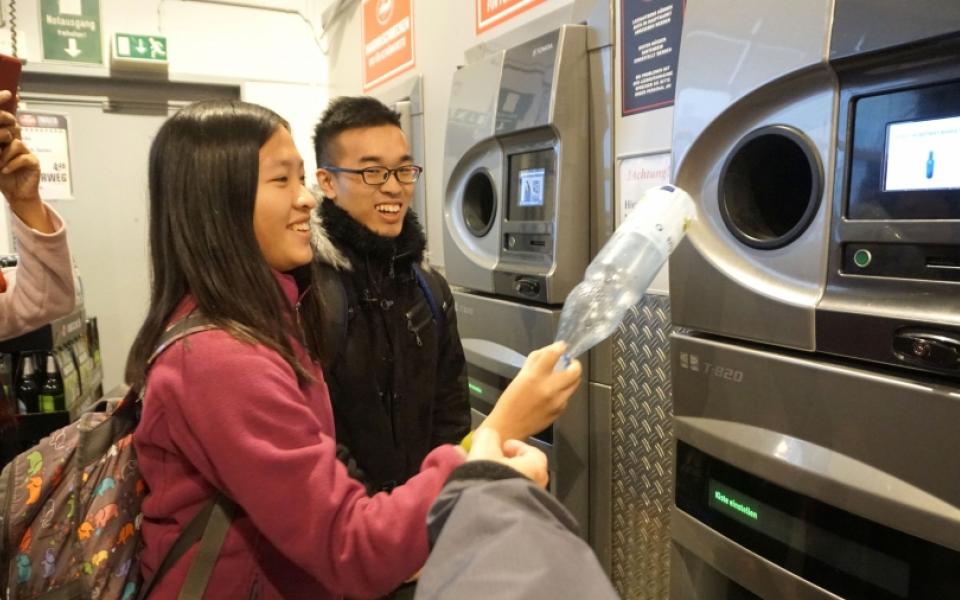 Students tried out the plastic bottle collection machine