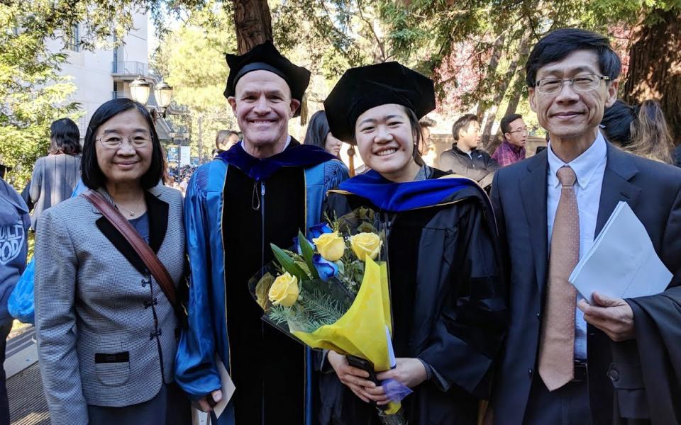 Graduation photo of daughter Clara, with thesis advisor Prof. Jay Keasling of UC Berkeley and mom and dad.