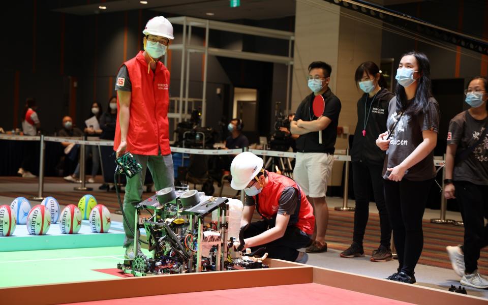 The contest was to play rugby game using two robots and five obstacles as five defending players.