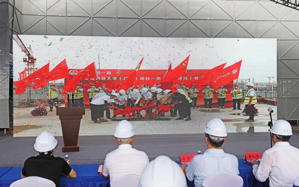 Attending Guests Celebrated the Concrete Pour at the Construction Site