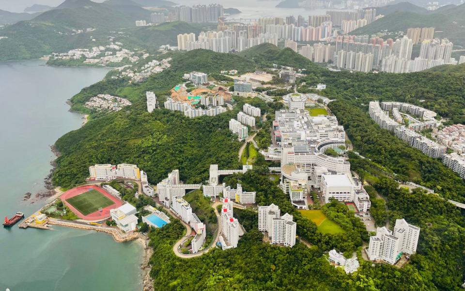 Helicopter flies over HKUST campus at Clear Water Bay.