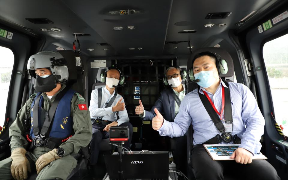 Secretary for the Environment Mr. WONG Kam-Sing (Back Left), HKUST President Prof. Wei SHYY (Back Right) and Associate Professor of Environment and Sustainability at HKUST Prof. NING Zhi (Front Right) takes a helicopter ride late last month to learn about the research progress.