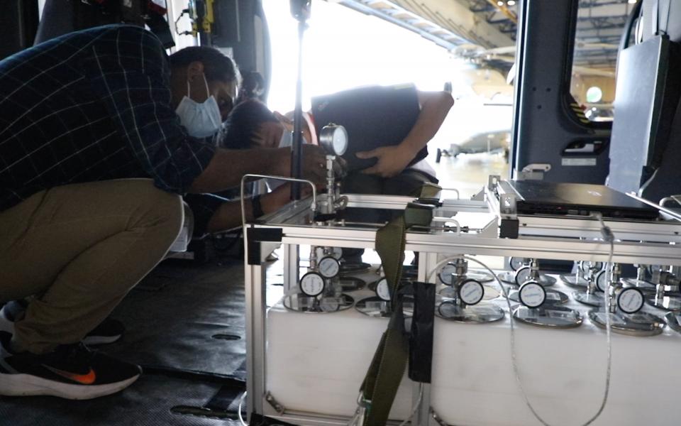 HKUST researchers install the air-monitoring equipment on a modified helicopter.