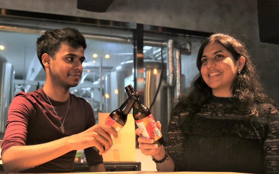 Anushka holding their beers