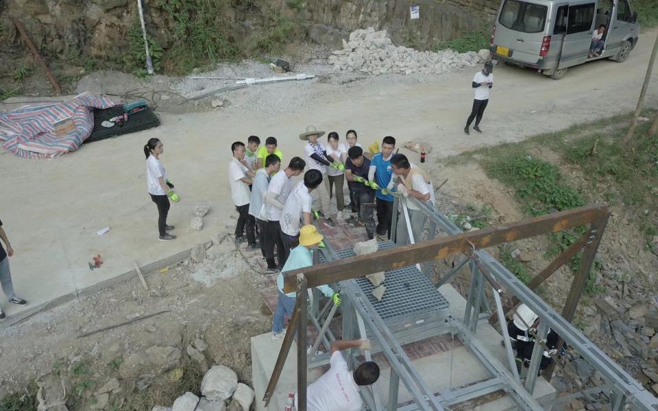 Student volunteers stablized the bridge structure.