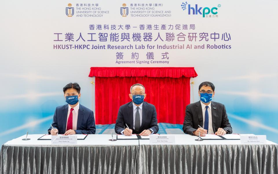 (From left) Prof. Charles Ng Wang-Wai, Vice-President for Graduate Support of HKUST (GZ) and CLP Holdings Professor of Sustainability of HKUST; Prof. Tim Cheng, Vice-President for Research and Development of HKUST; and Mr. Mohamed Butt, Executive Director of HKPC, sign the agreement to establish HKUST-HKPC Joint Research Lab for Industrial AI and Robotics.