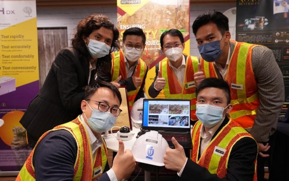 The winning team of the Sino-HKUST One Million Dollar Entrepreneurship Competition founded AutoSafe, an AI solution company leveraging smart technology to modernize and automate worksite safety monitoring while improving efficiency. In the photo: Issac LEUNG, co-founder (first left, back row), Prof. Jack CHENG (second right, back row), and Peter WONG, co-founder (first right, front row).