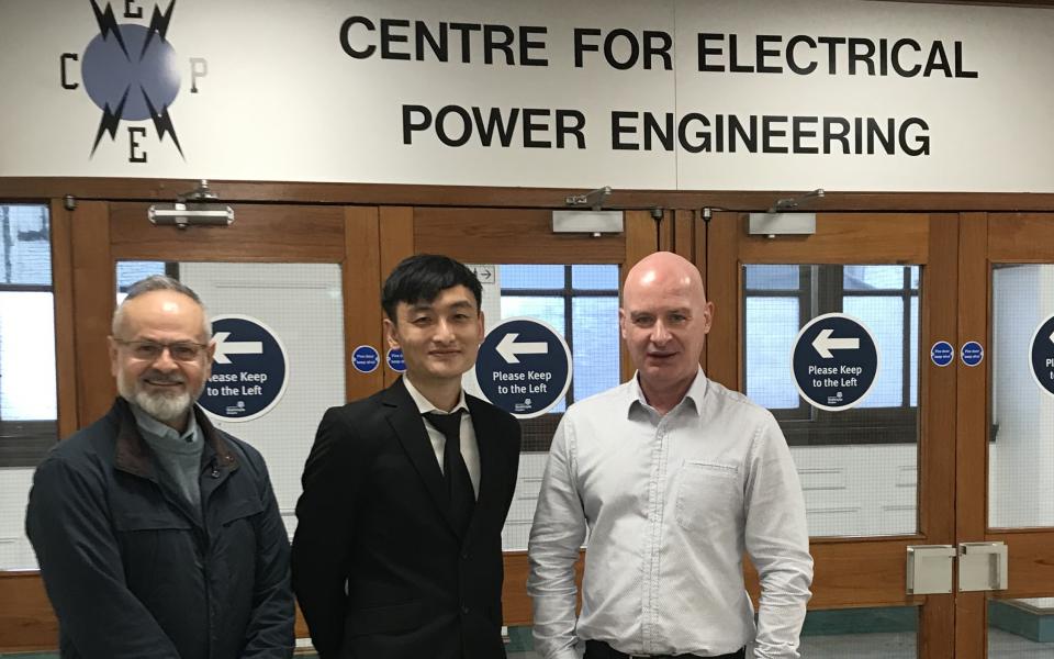 Prof. Campbell Booth (right) and Dr. Olimpo Anaya-Lara (left), who are Vice Dean (Research) and Associate Dean (International) respectively at Strathclyde’s Faculty of Engineering, and Binnie.