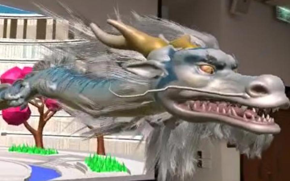  A demonstration of the physical-digital MetaHKUST: With augmented reality technology, users can view digital art work (like the dragon shown in this video) brought to life in real classrooms through their smart phones.