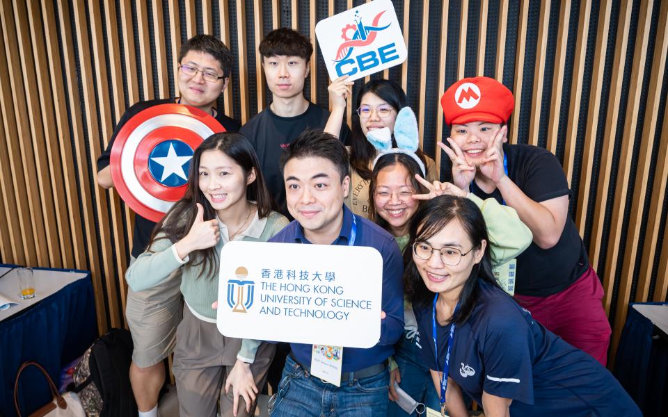 Faculty and students took photos with props at a photo booth after the opening gala.