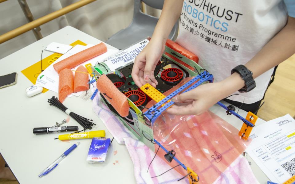 Students designed their robots using different materials in the final competition in May.