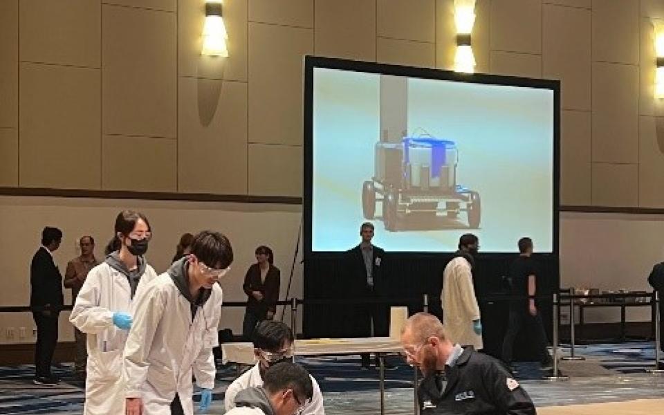 The HKUST Chem-E-Car Team set up their car at the starting line of the competition.