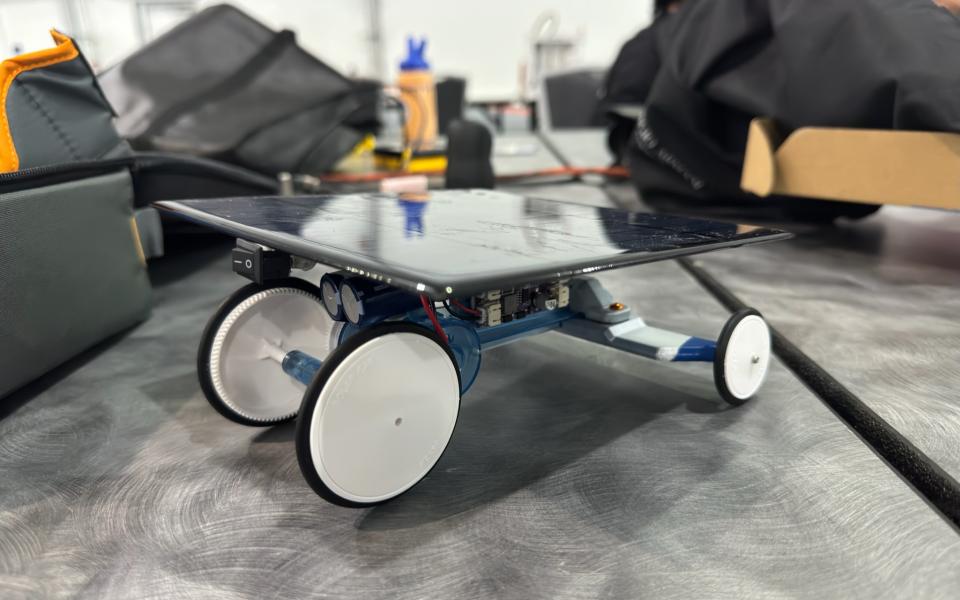 The HKUST team successfully created the fastest solar-powered robot and collected the gold medal in the Beam Speeder event.