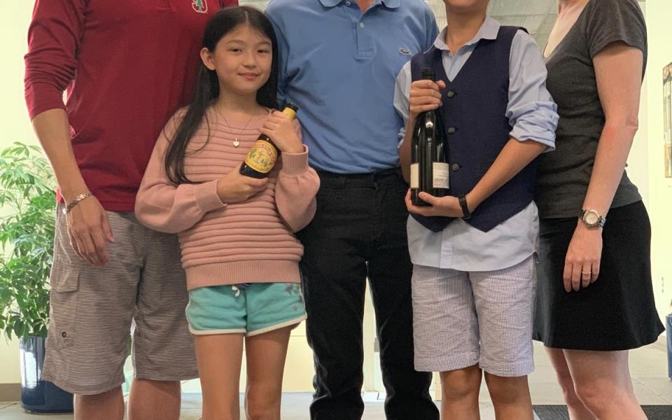 Prof. Patrick Yue (first left) with his family and Prof. S Simon Wong (center)