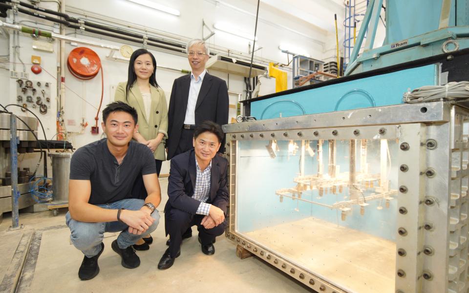 Prof. Charles NG, Associate Vice-President (Research and Development) of HKUST (front right) and the Project Coordinator; Mr. PUN Wai-Keung, Head of Geotechnical Engineering Office of the HKSAR Government (back right); Ms. Eva LAM, Director of Hong Kong Jockey Club Disaster Preparedness and Response Institute (back left); and Dr. Clarence CHOI, Research Assistant Professor, Civil and Environmental Engineering of HKUST with the centrifuge environmental chamber developed by HKUST.