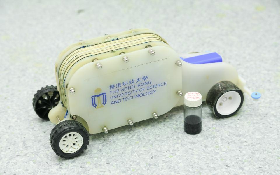 A demonstration vehicle with a bottle of the e-fuel.