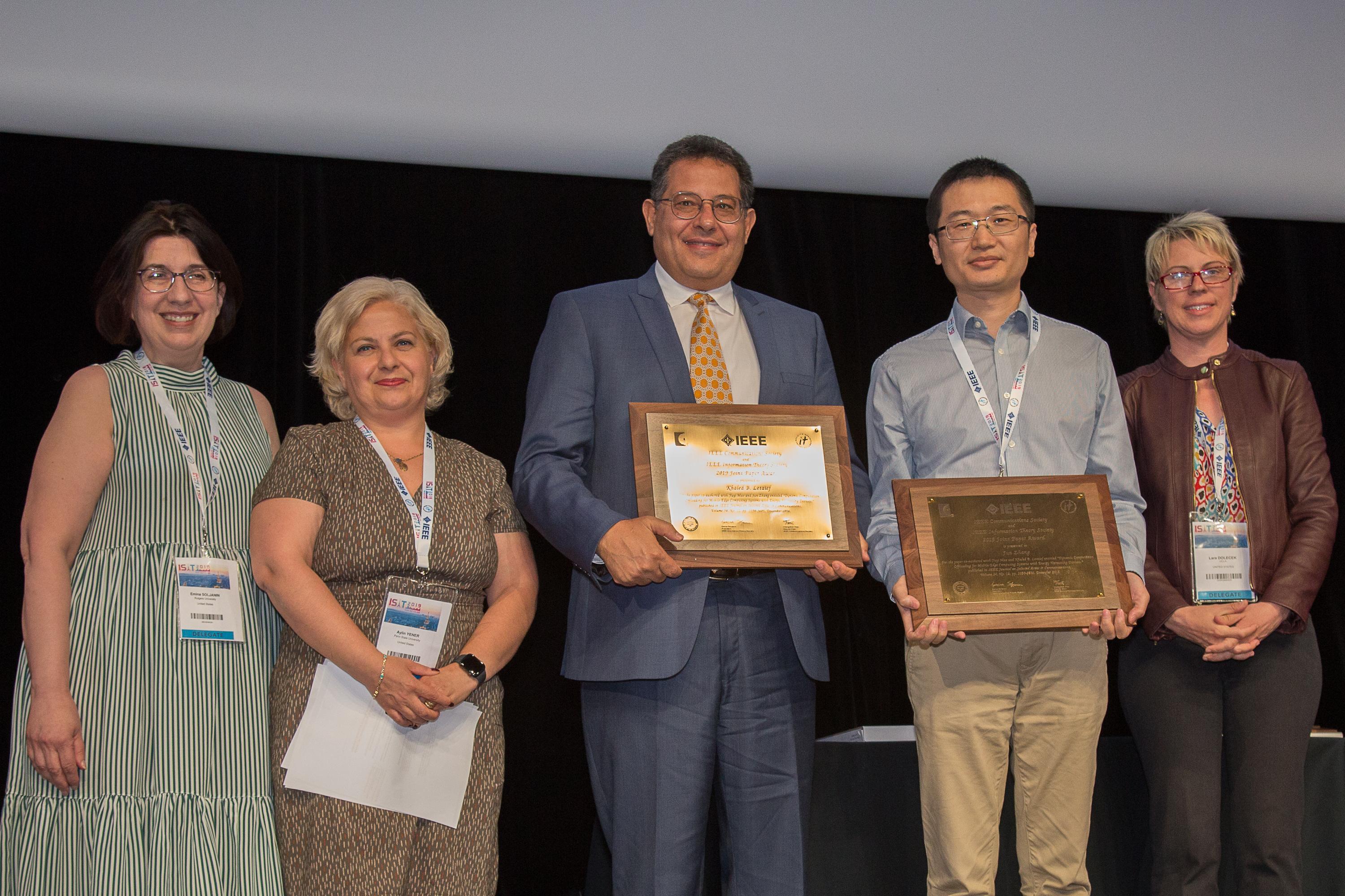 Prof. Khaled Ben Letaief (center) and Prof. Zhang Jun (second right) received the award at the 2019 IEEE International Symposium on Information Theory in Paris on July 9.	